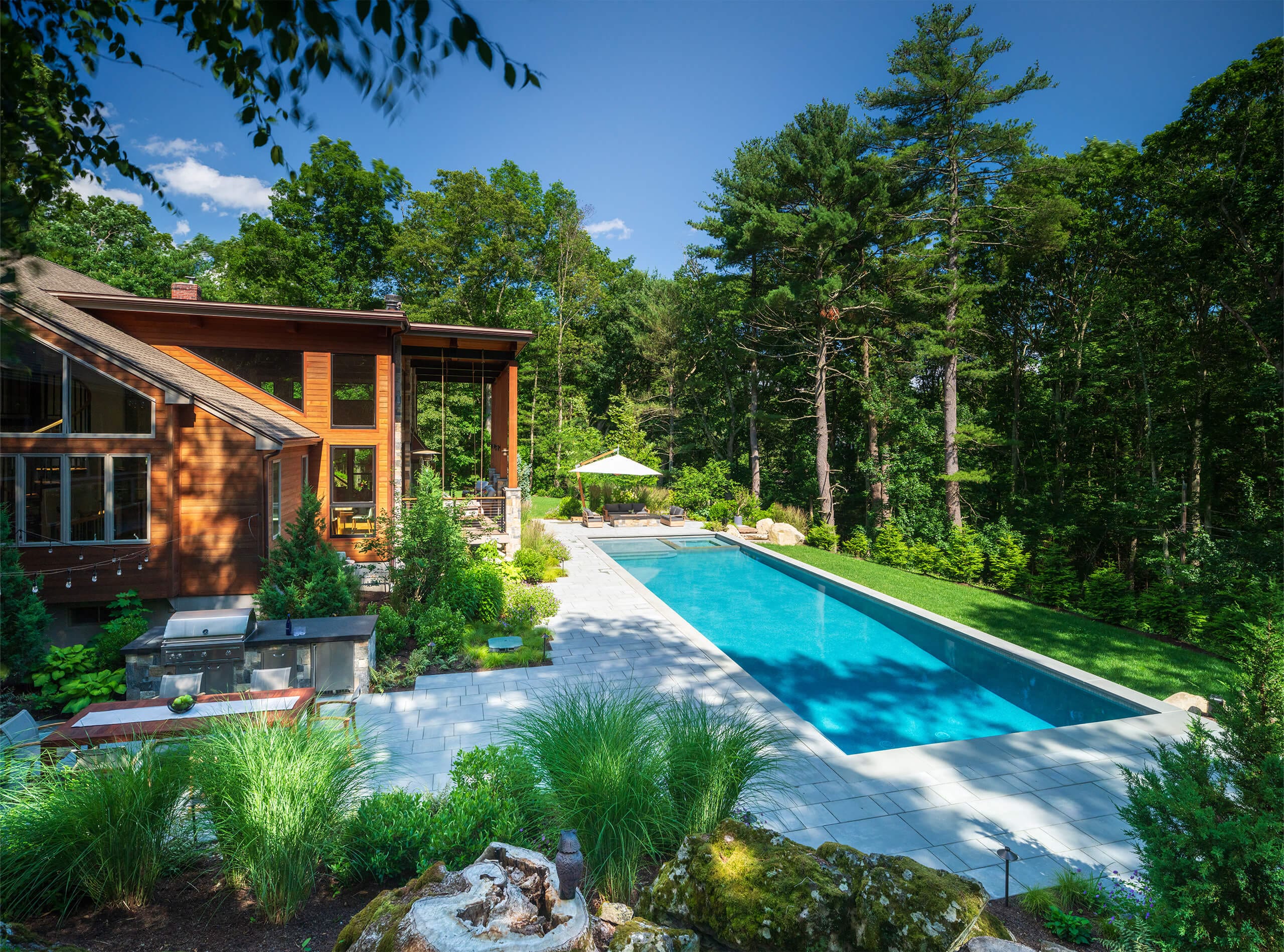Layered garden planting with complementary foliage, flowers, and natural textures