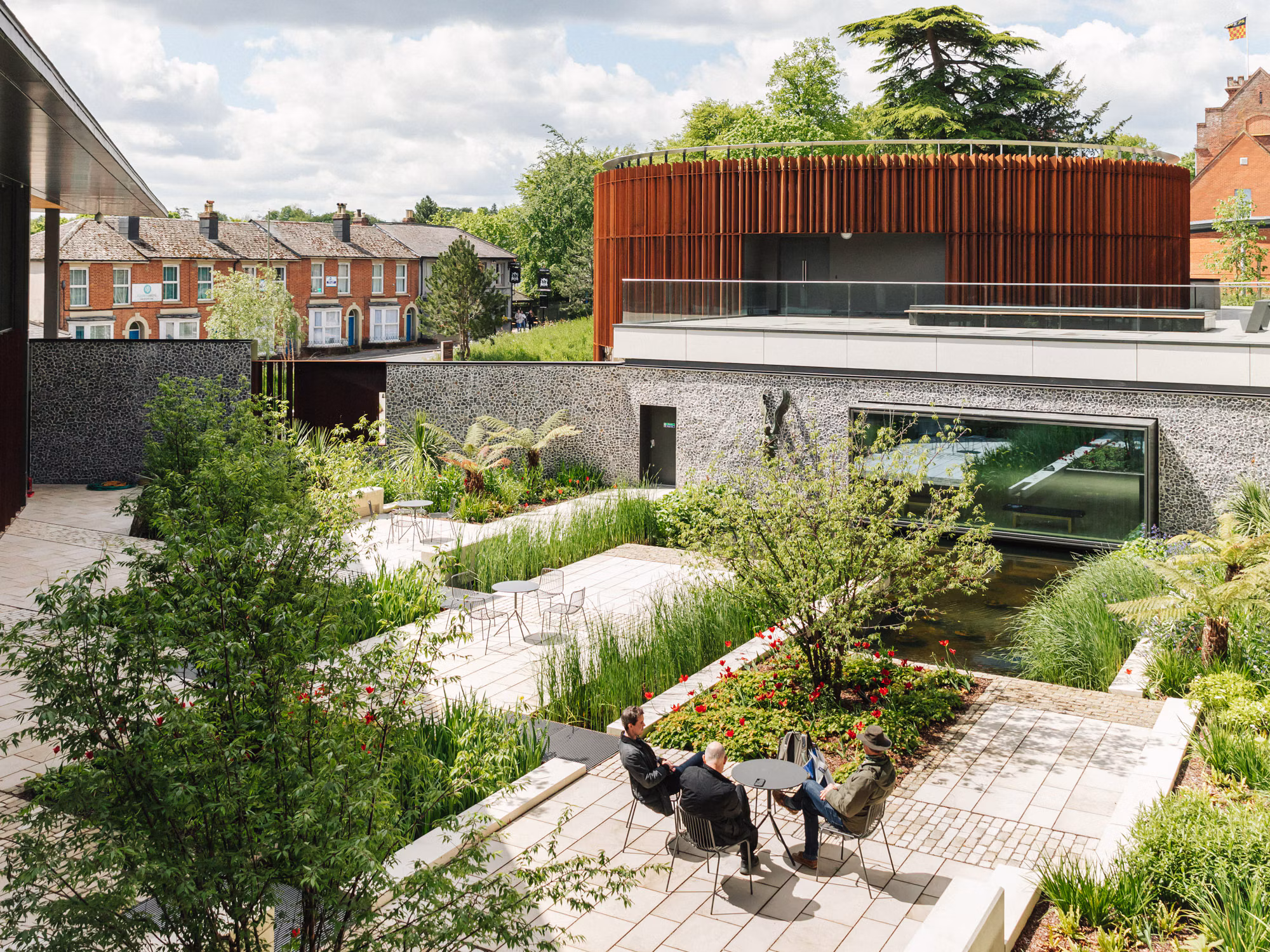 Refined garden pathway framed by balanced greenery and carefully arranged landscape features