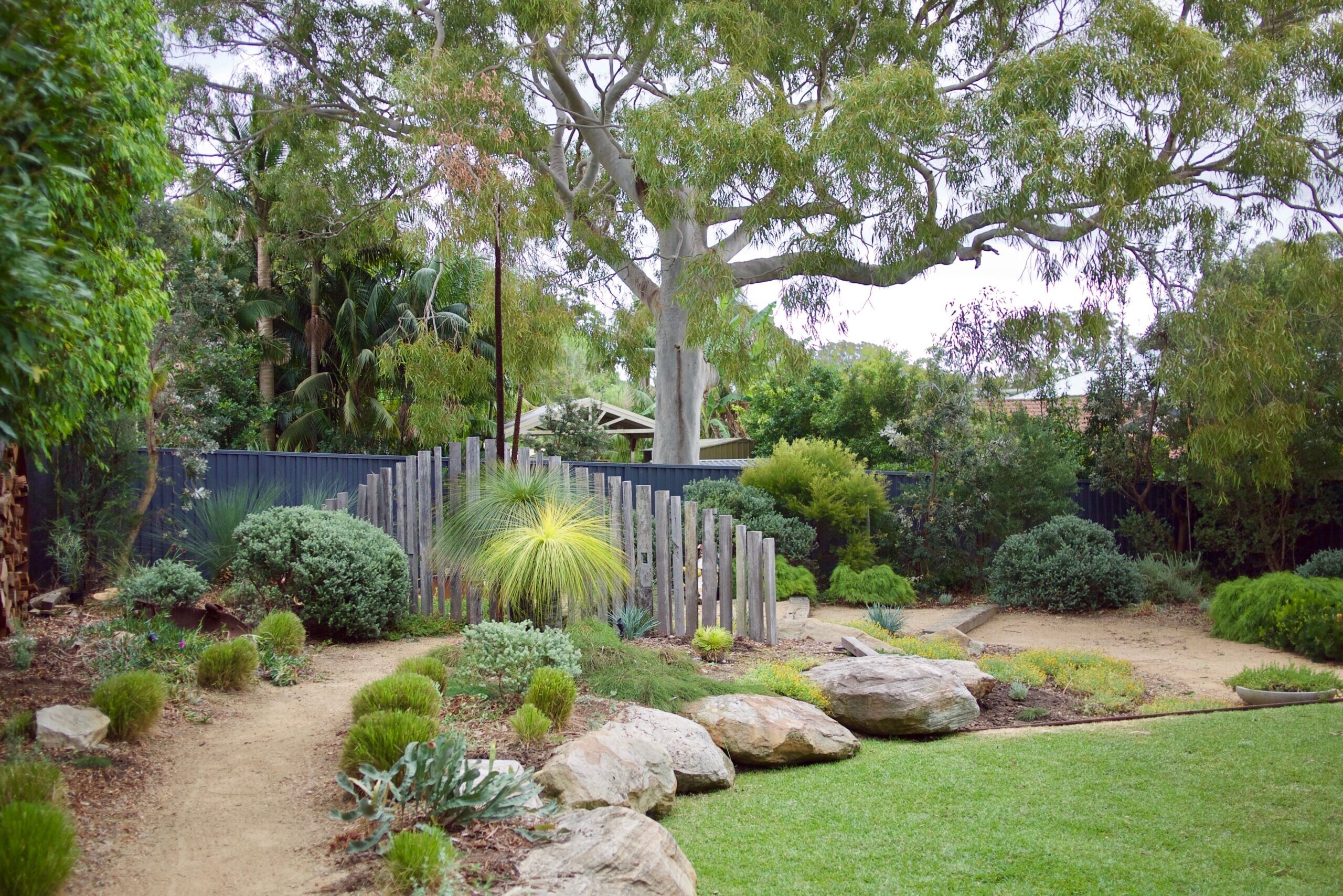 Thoughtfully designed garden with layered planting and harmonious landscape details