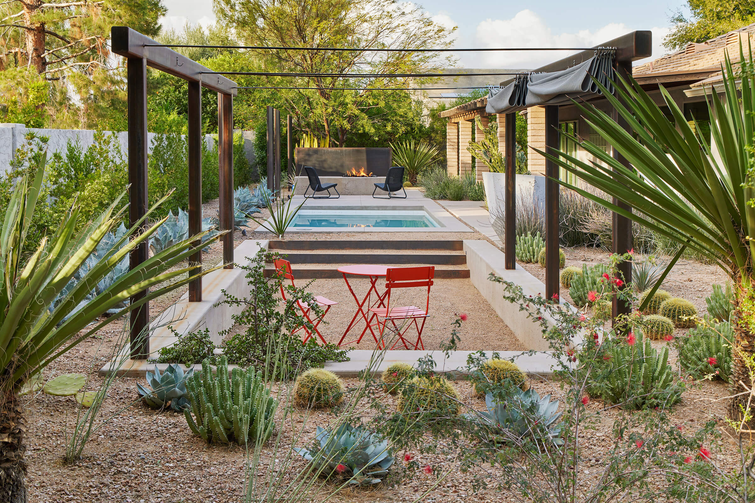 Landscape designer reviewing garden inspiration and plant combinations for a custom outdoor project